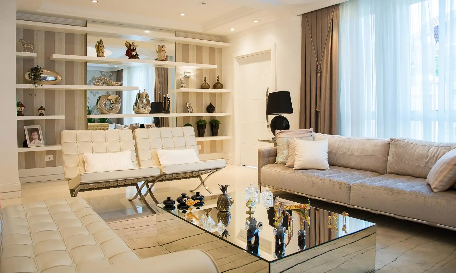 A living room with sofa and chairs