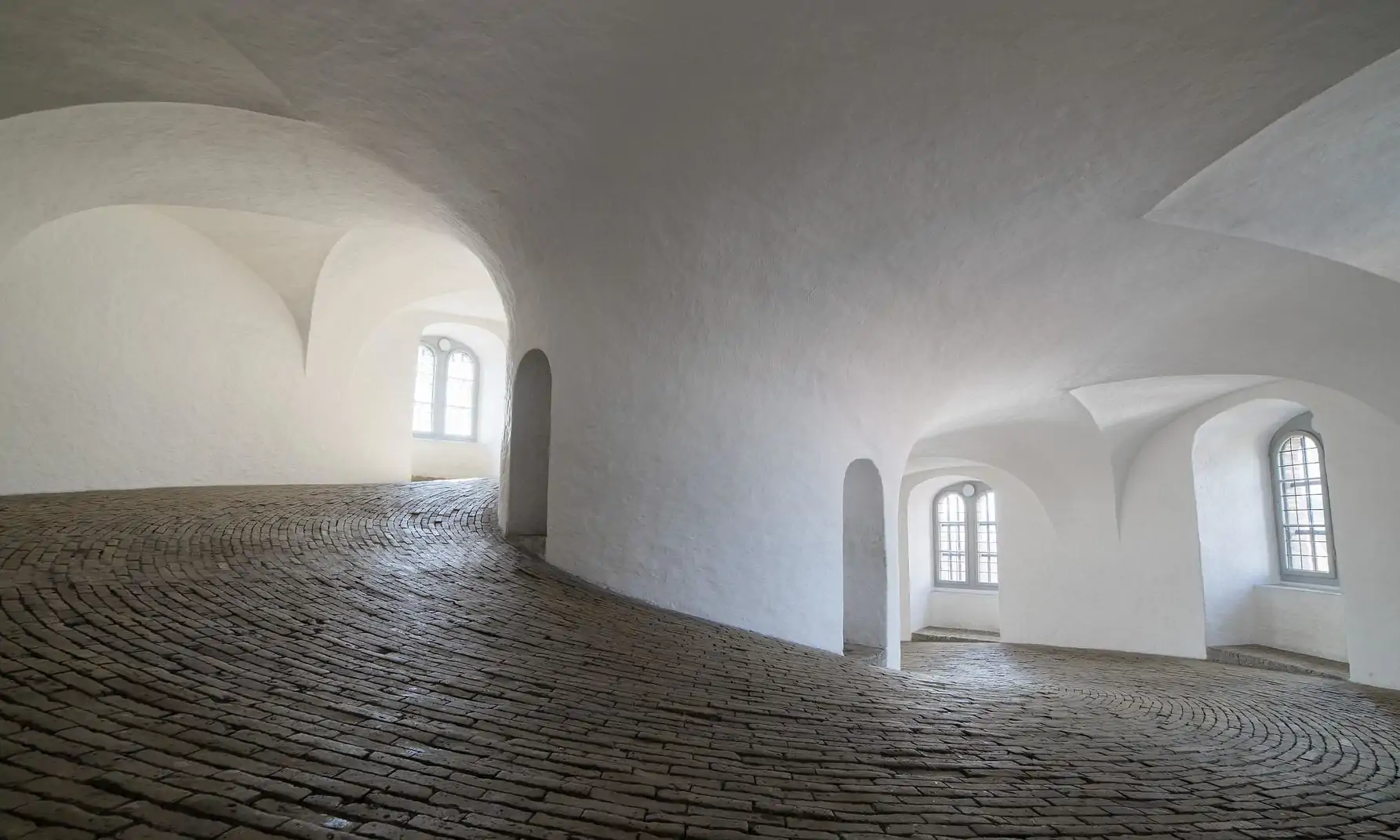 A corridor inside a white building