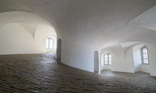A corridor inside a white building